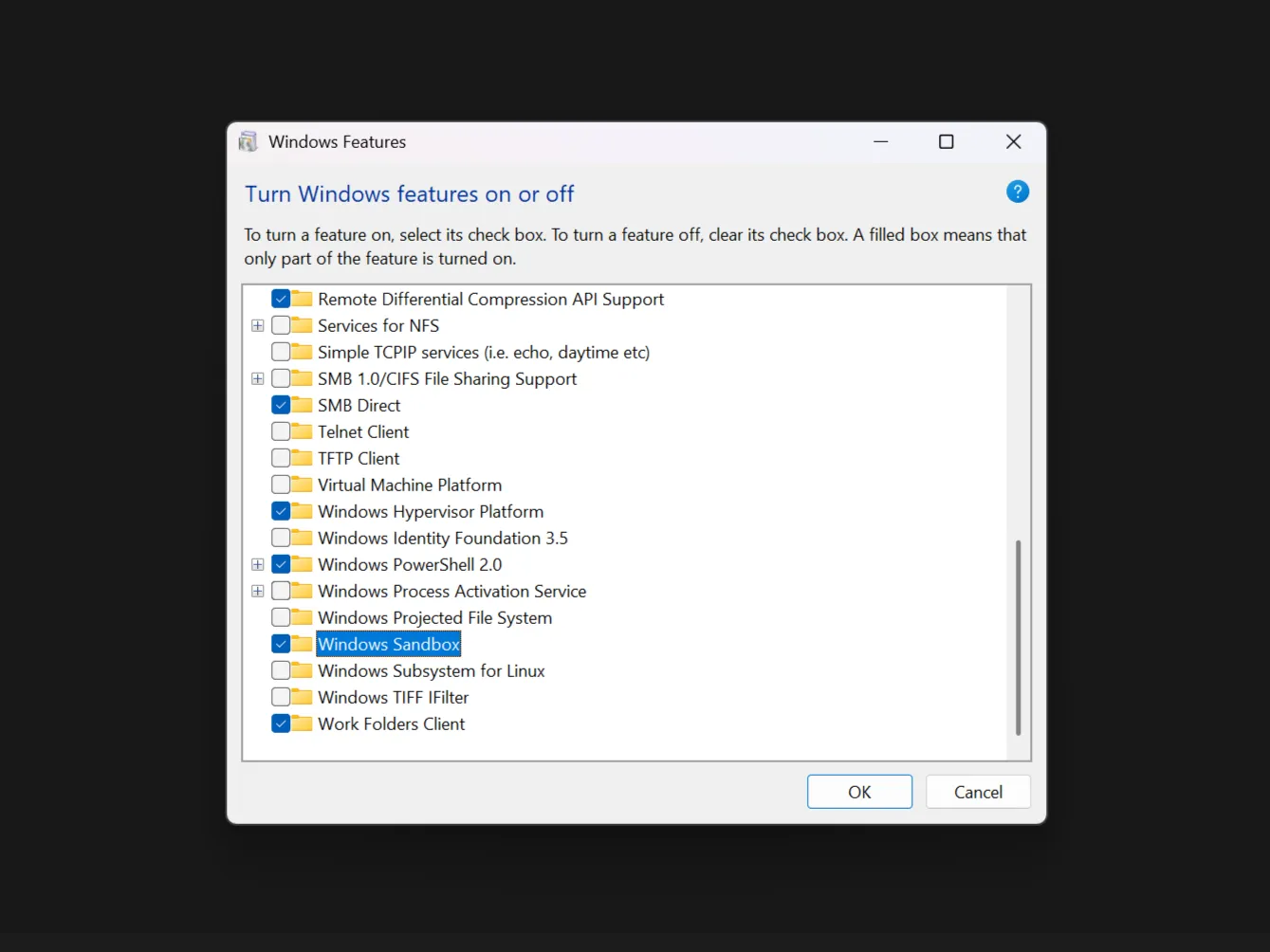 Cửa sổ 'Windows Features' hiển thị tính năng Windows Sandbox được đánh dấu đã bật, cho phép người dùng chạy file nghi ngờ trong môi trường an toàn.