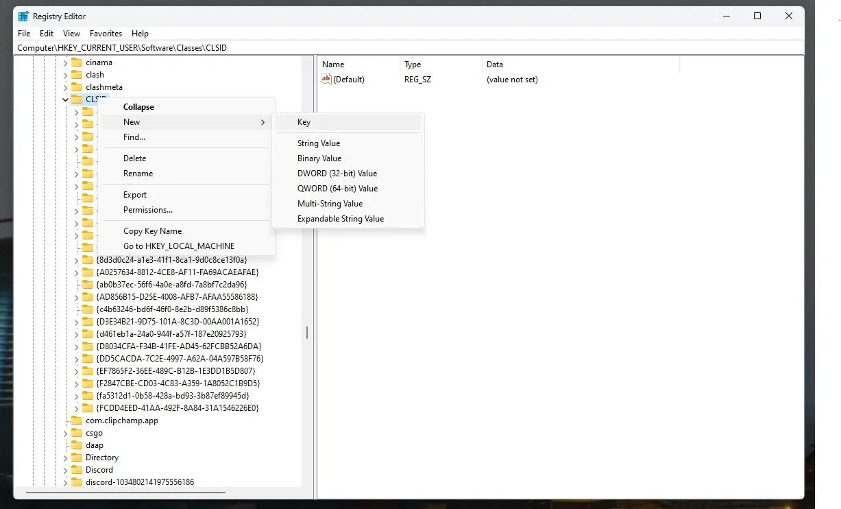 Giao diện Registry Editor hiển thị cách tạo khóa con CLSID để khôi phục menu chuột phải Windows 11