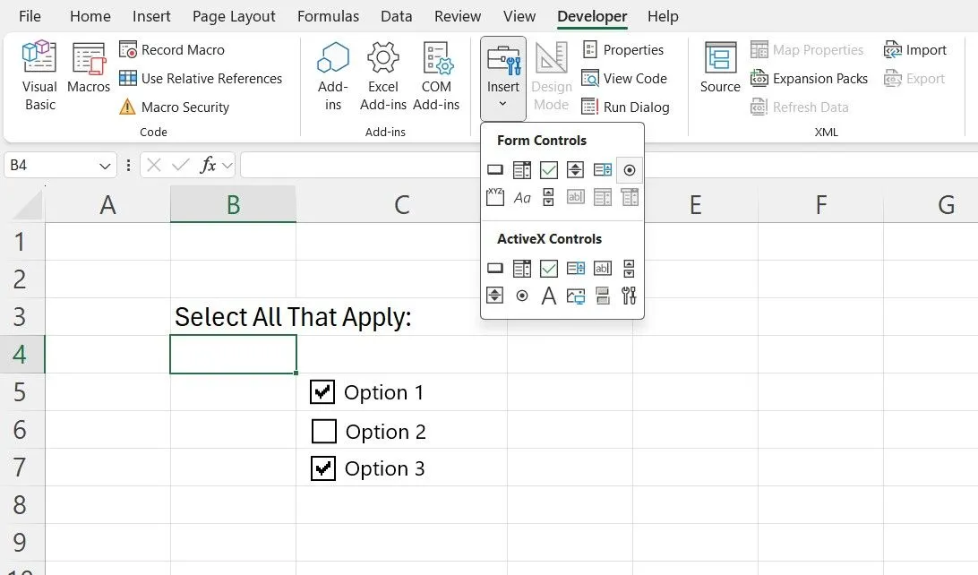 Giao diện tab Nhà Phát triển (Developer) trong Excel hiển thị các công cụ điều khiển biểu mẫu như ô chọn (checkbox) để tạo form tương tác.