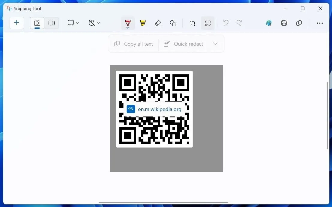 Giao diện ứng dụng Snipping Tool trên Windows 11 đang quét mã QR, làm nổi bật biểu tượng Tác vụ Văn bản (Text Actions).