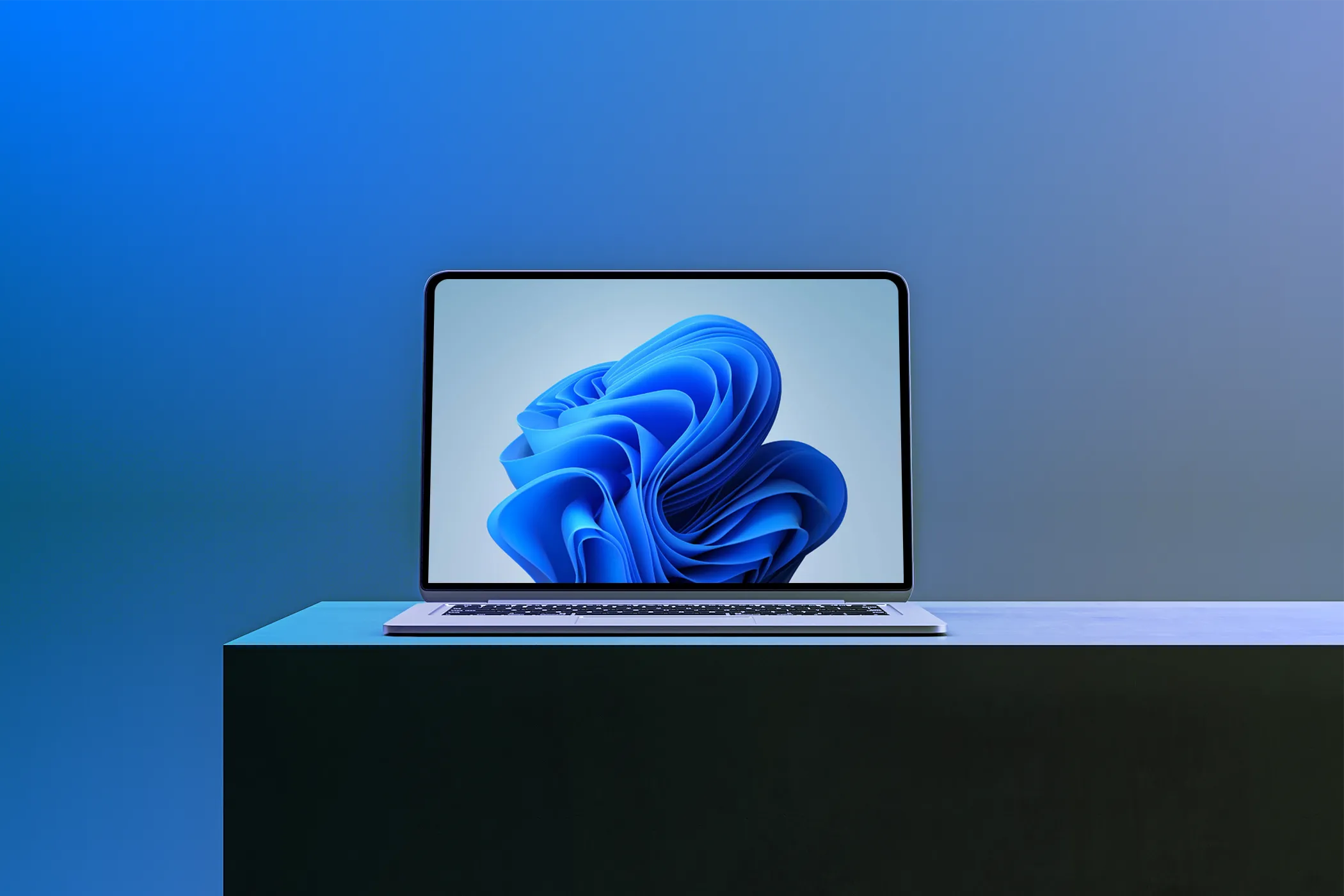Hình ảnh một chiếc laptop hiển thị hình nền Windows 11