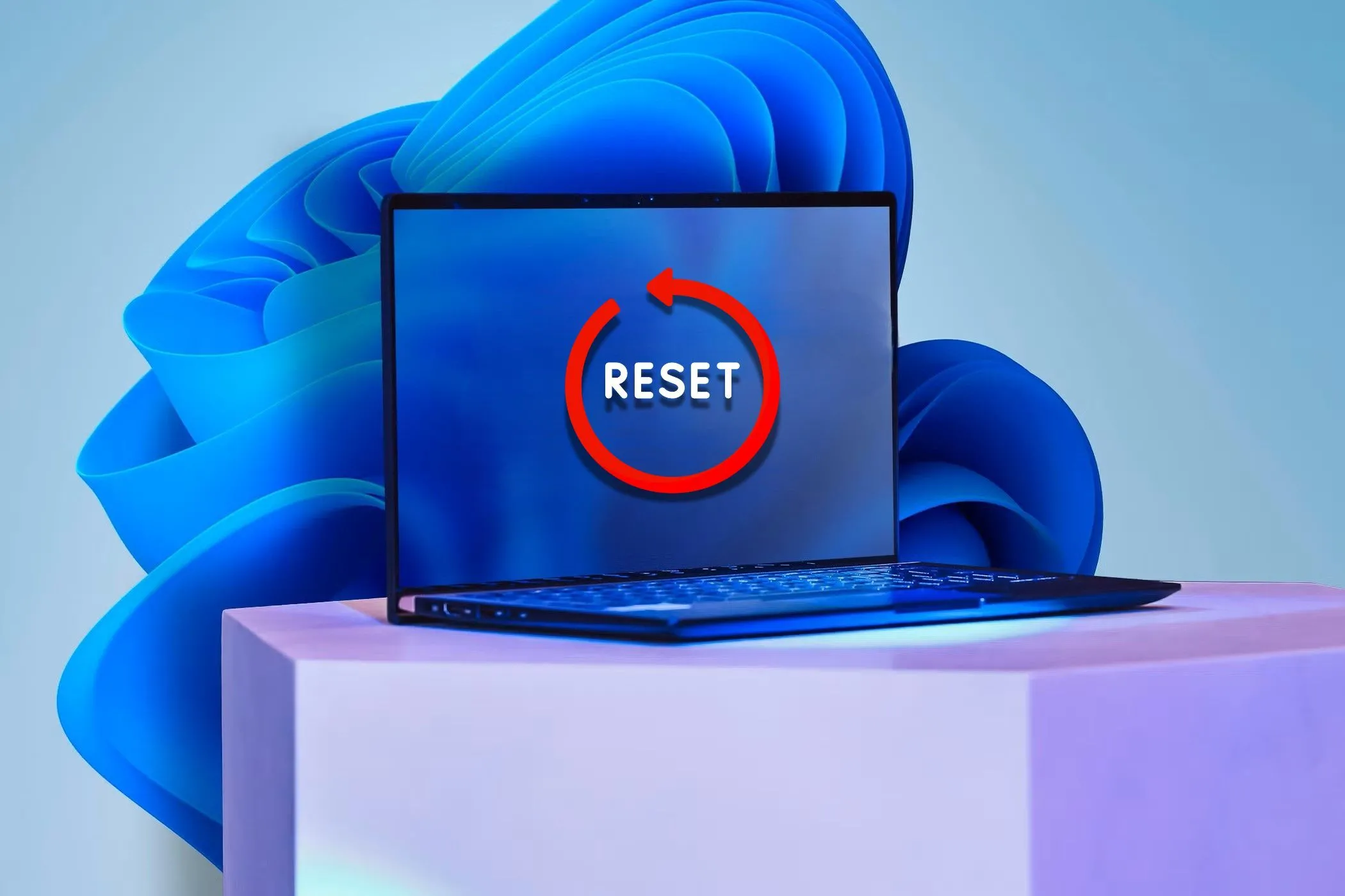 Laptop dán nhãn &quot;Reset&quot; trên màn hình hiển thị hình nền Windows 11, tượng trưng cho giải pháp cuối cùng tái định dạng để loại bỏ malware dai dẳng