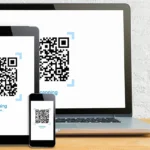 Laptop, máy tính bảng và điện thoại hiển thị mã QR xác thực tài khoản Gmail an toàn