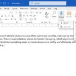 Màn hình Microsoft Word hiển thị tính năng Dictate (chuyển giọng nói thành văn bản) được kích hoạt trên thanh Ribbon, giúp người dùng gõ văn bản nhanh chóng.
