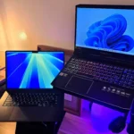 Máy tính xách tay chạy Windows 11 và macOS hiện đại, minh họa cho khả năng khởi động nhanh nhờ ổ SSD.