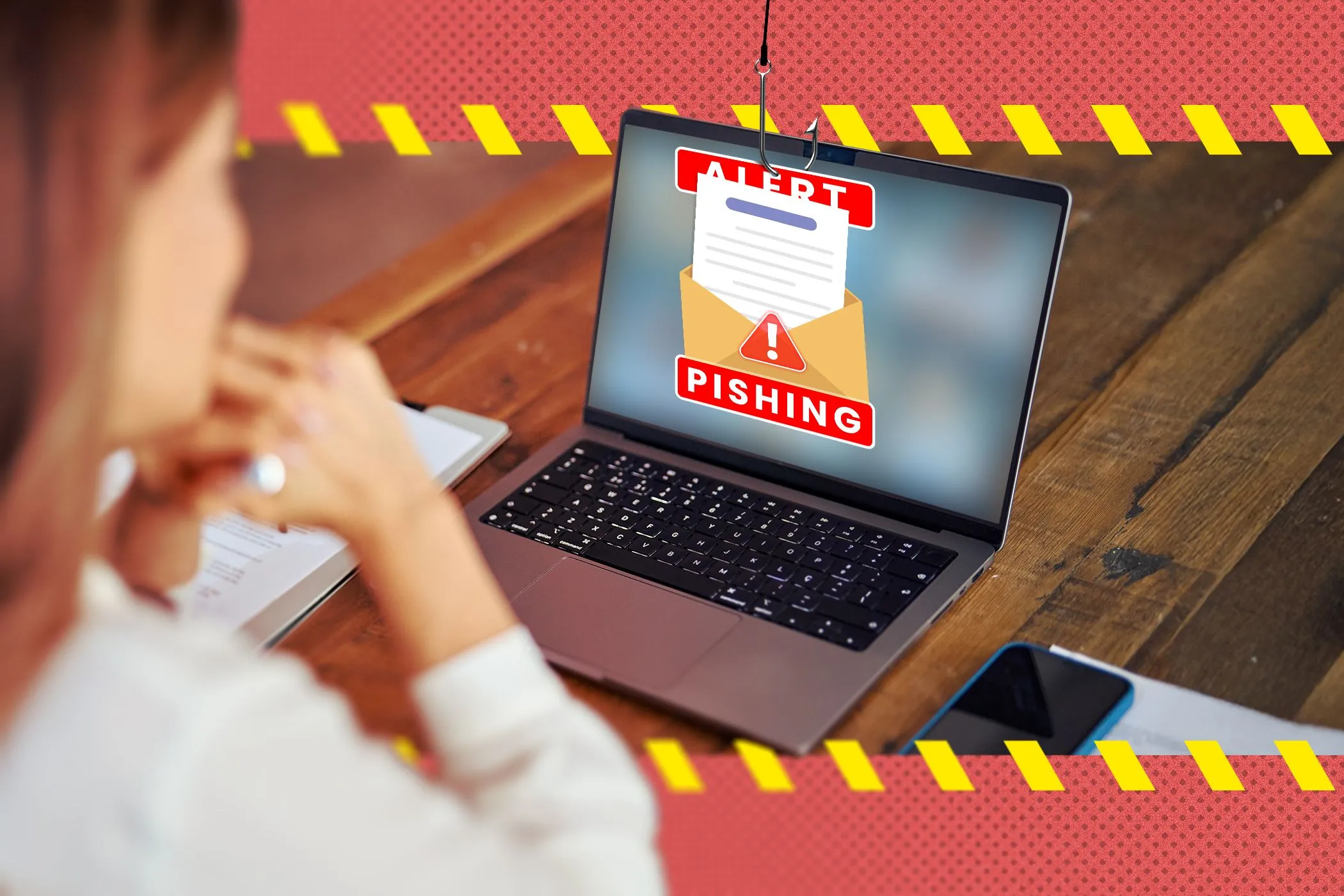 Người phụ nữ làm việc trên laptop với màn hình hiển thị email lừa đảo phishing