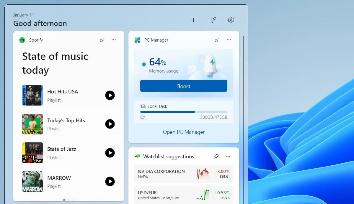 Widget Spotify trên bảng điều khiển tiện ích Windows 11 cho phép điều khiển nhạc và chuyển playlist.